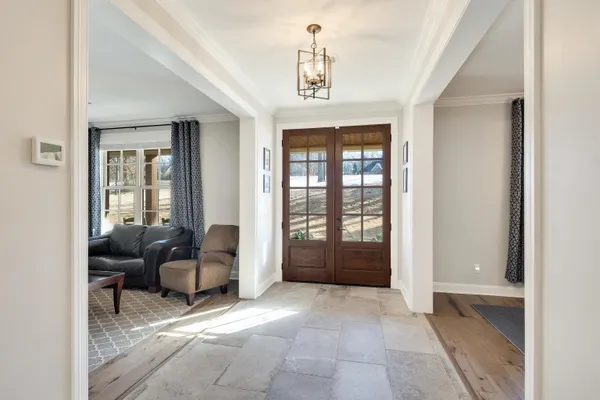 a utility room with cabinets washer and dryer
