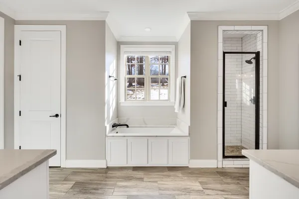 a kitchen with a refrigerator a sink and dishwasher with wooden floor