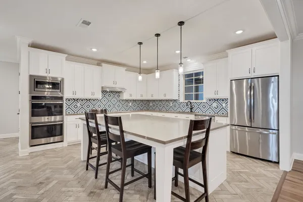 a view of a house with swimming pool and sitting area