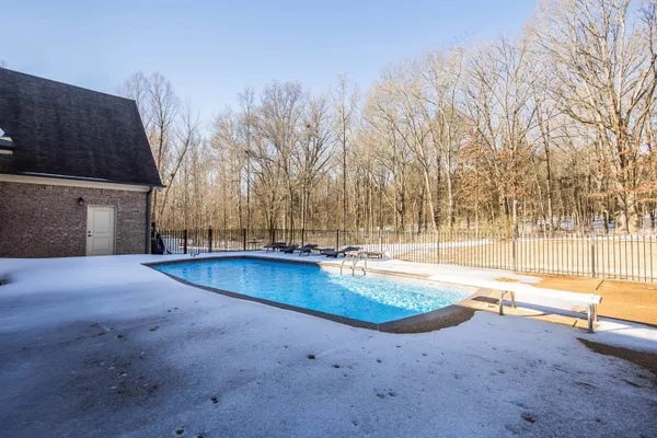 a hallway with wooden floor and furniture