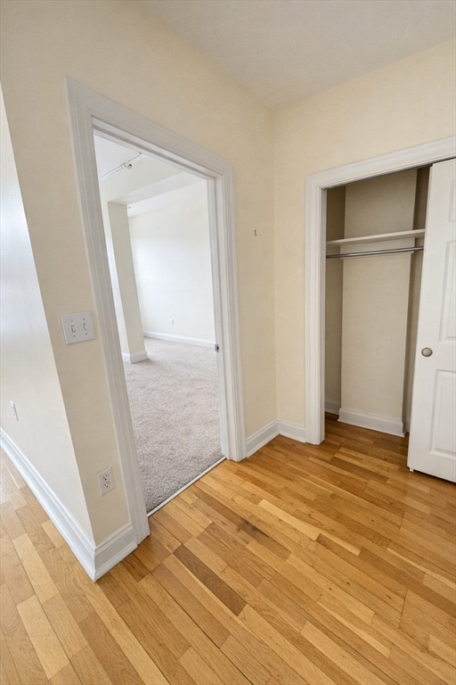 7 Central Square, Unit 203 Lynn, MA 01901 - Photo 5 of 13 a view of an empty room with wooden floor