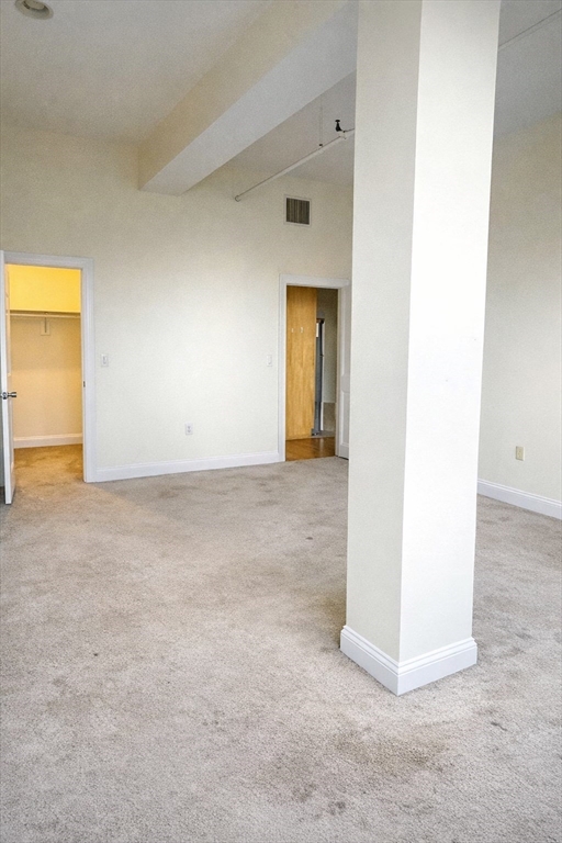 7 Central Square, Unit 203 Lynn, MA 01901 - Photo 6 of 13 an empty room with a door