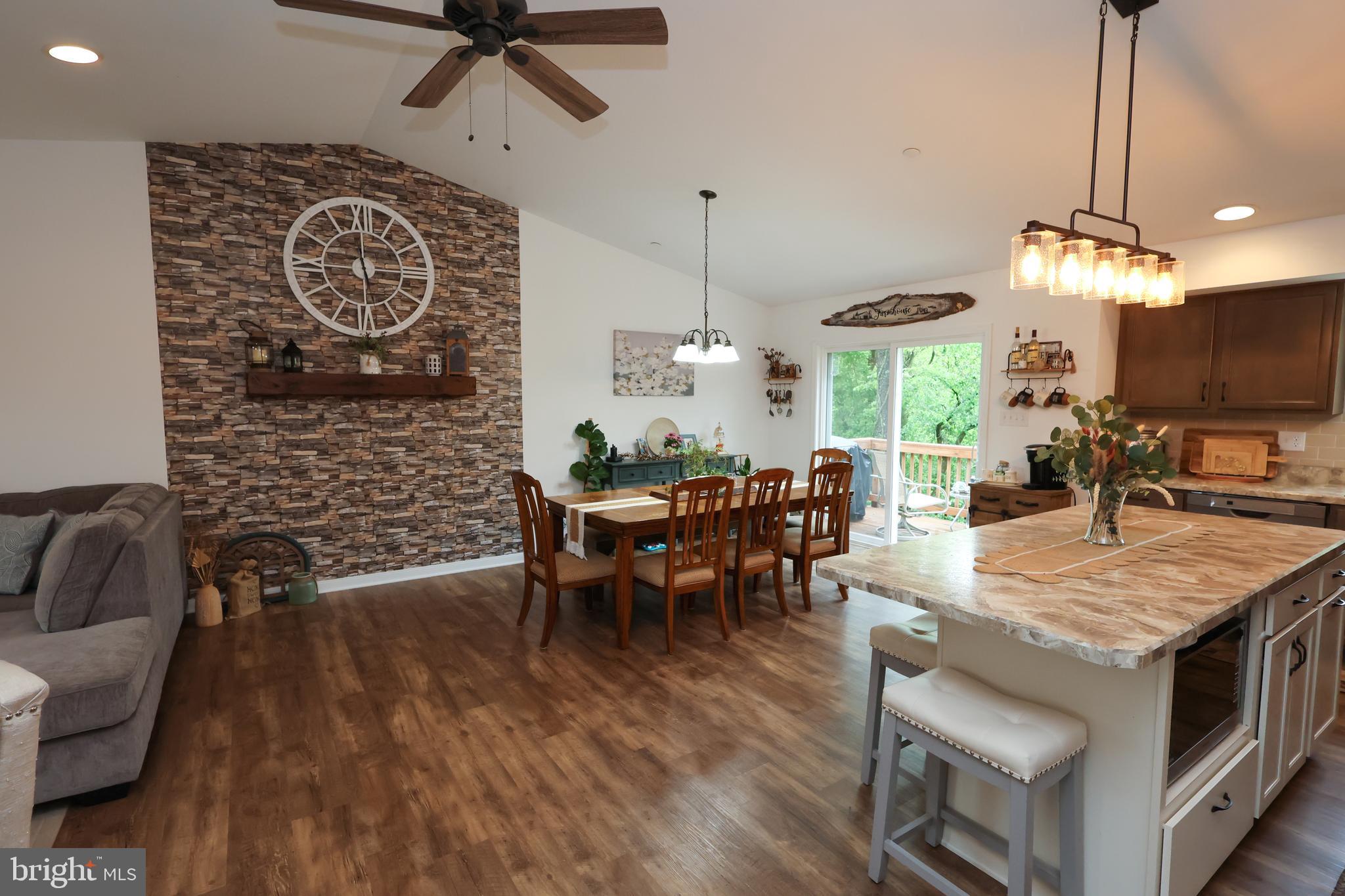 16919 Shaffer Road Sharpsburg, MD 21782 - Photo 9 of 58 a view of a dining room with furniture and wooden floor