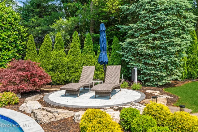 a view of a backyard with swimming pool