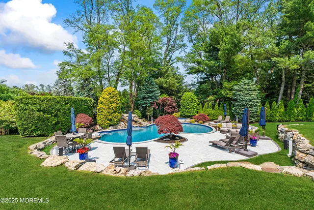 a view of a patio with couches chairs and wooden floor