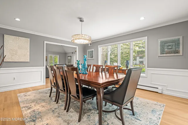 a bathroom with a bathtub shower sink vanity and a toilet
