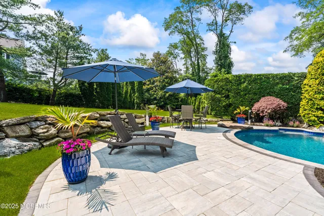a view of a swimming pool with a patio