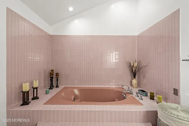 a view of a backyard with lawn chairs and a fire pit