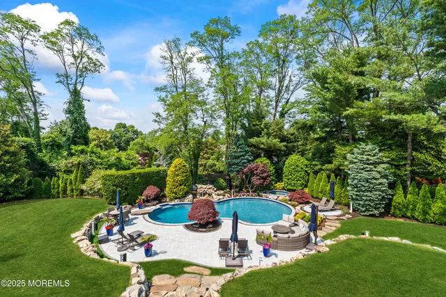 a view of a table and chairs in patio with a garden