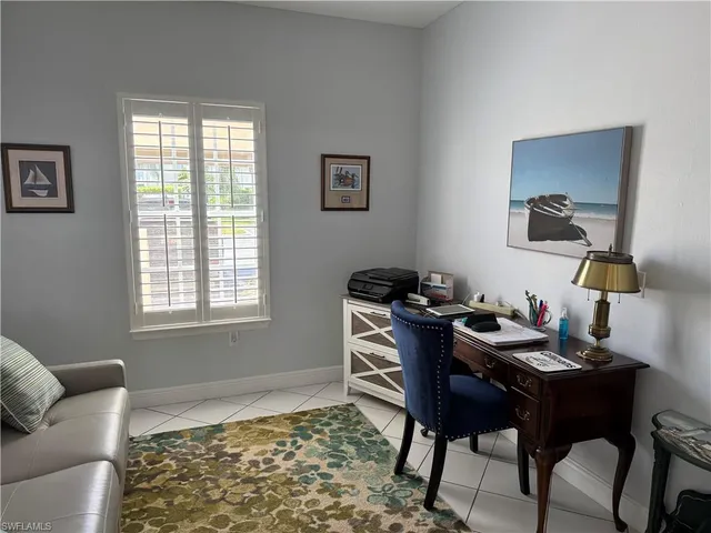 a workspace with furniture and window