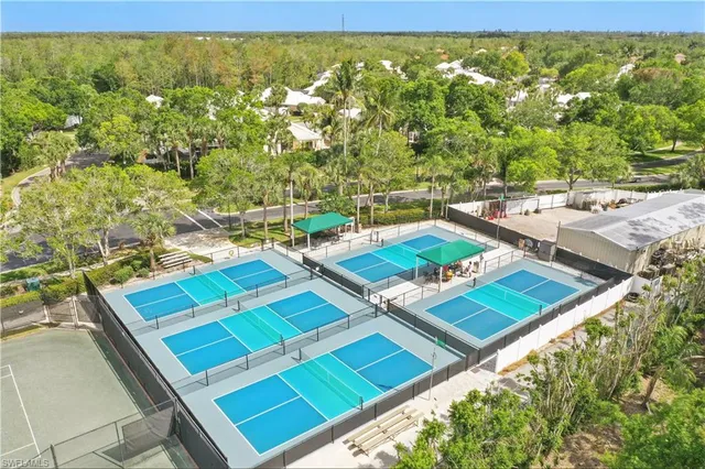 a view of a balcony with chairs and a table