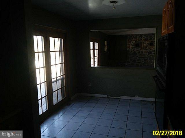 13028 Oliver Beach Road Baltimore, MD 21220 - Photo 14 of 21 a view of empty room with windows