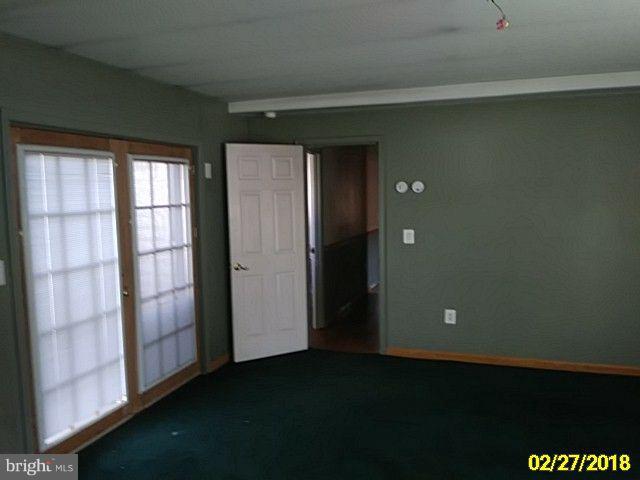 13028 Oliver Beach Road Baltimore, MD 21220 - Photo 20 of 21 an empty room with windows