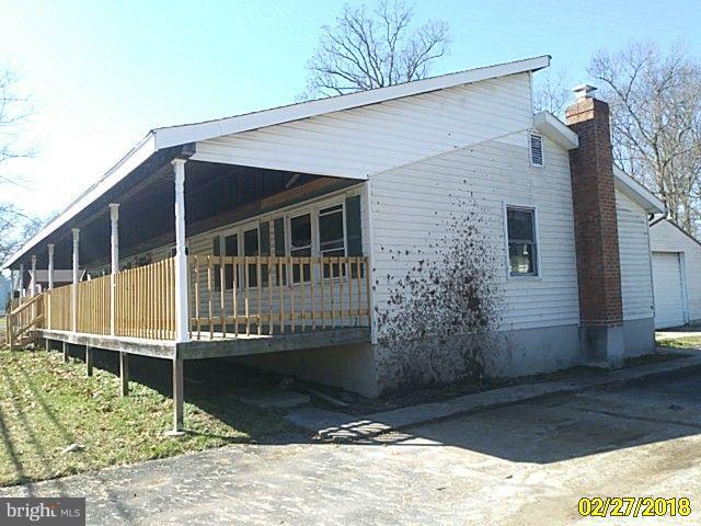 13028 Oliver Beach Road Baltimore, MD 21220 - Photo 3 of 21 a view of a house with a door