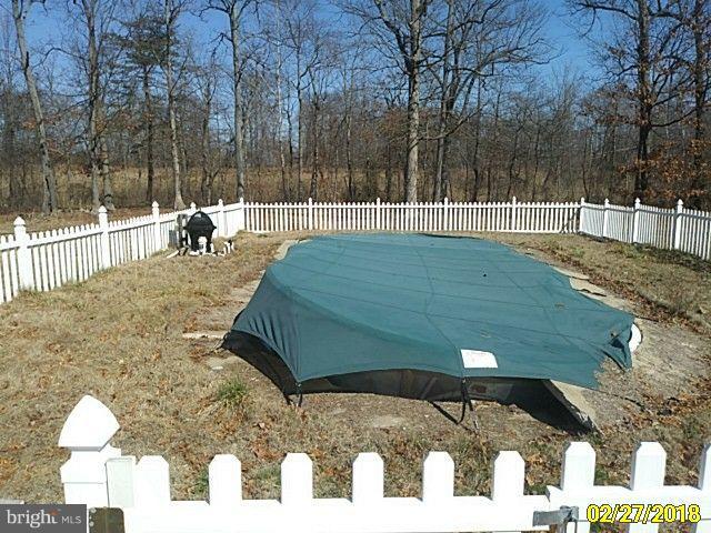 13028 Oliver Beach Road Baltimore, MD 21220 - Photo 7 of 21 a view of a backyard