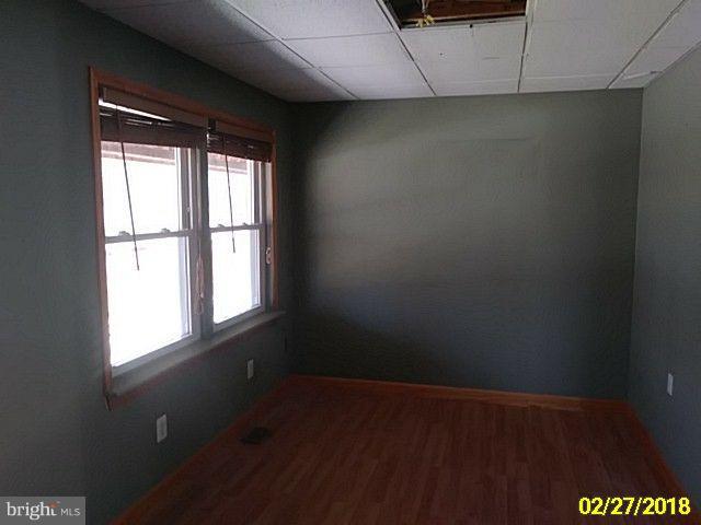 13028 Oliver Beach Road Baltimore, MD 21220 - Photo 10 of 21 an empty room with a window