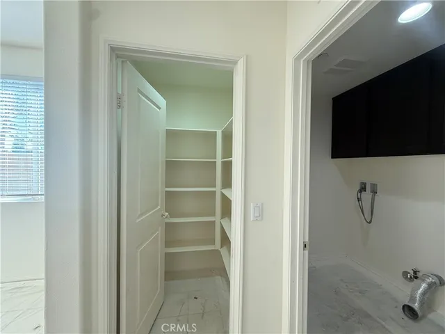 a view of a bathroom with a flat screen tv