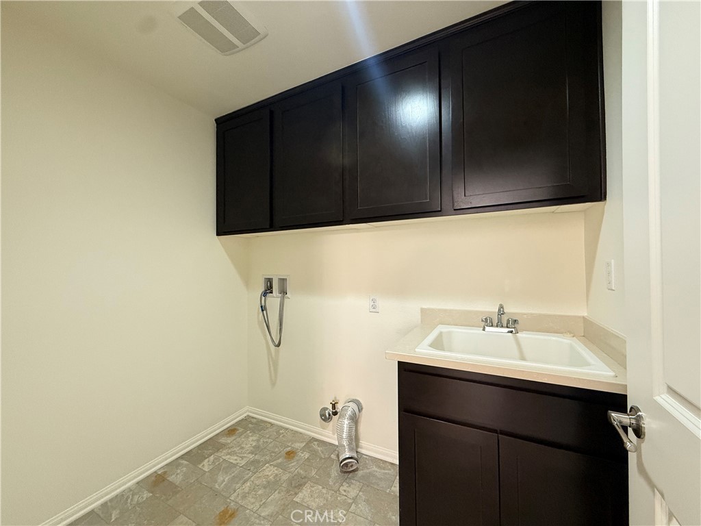 12319 Twin Gables Drive Chino, CA 91710 - Photo 17 of 42 a bathroom with a sink and a mirror