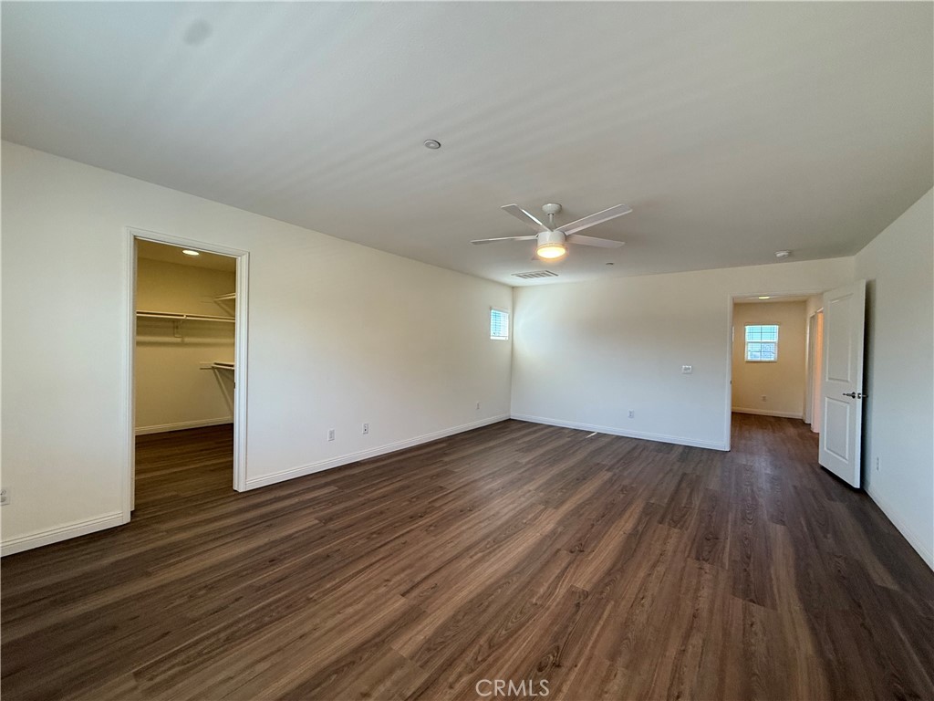 12319 Twin Gables Drive Chino, CA 91710 - Photo 18 of 42 an empty room with wooden floor closet and windows