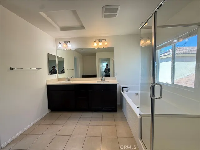 a bathroom with a sink a vanity and a mirror