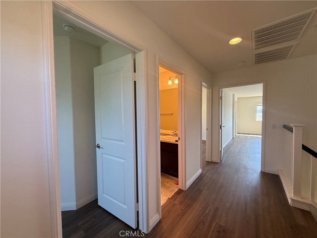 12319 Twin Gables Drive Chino, CA 91710 - Photo 32 of 42 a view of a hallway with wooden floor