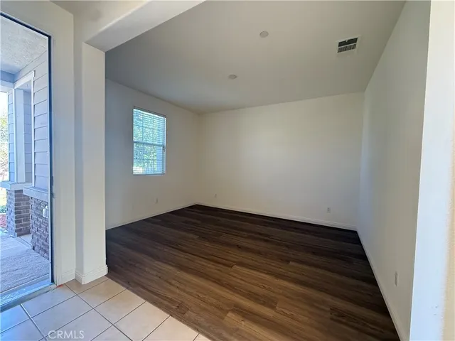 a view of room with window and hardwood floor