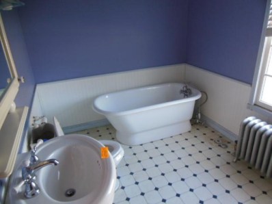 8939 Kleinman Road Highland, IN 46322 - Photo 4 of 9 a bathroom with a toilet and a sink