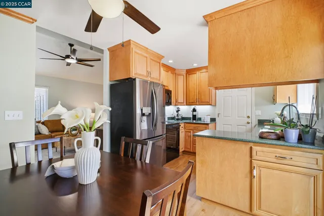 a bedroom with a bed a flat screen tv and a large window