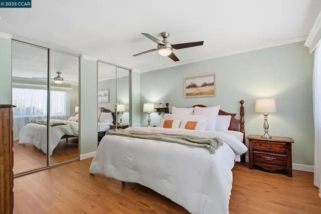 a bedroom with a bed and a chair