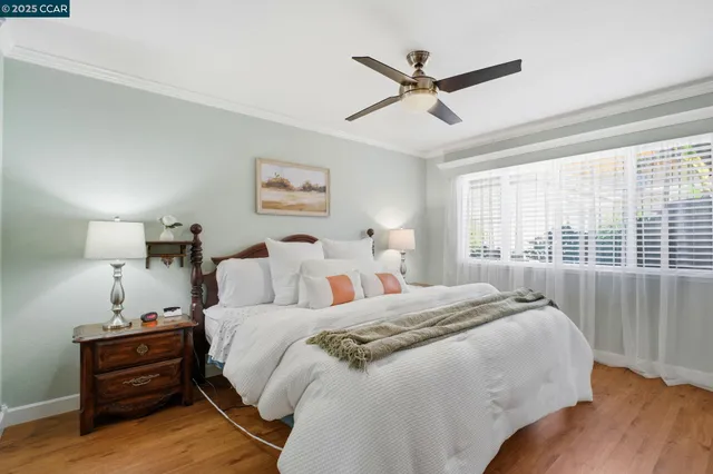 a front view of a house with outdoor seating and flowers