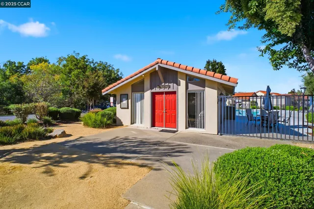 a view of a swimming pool with a yard and mountain view