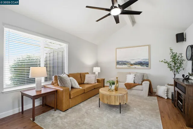 a kitchen with stainless steel appliances granite countertop a refrigerator stove and cabinets