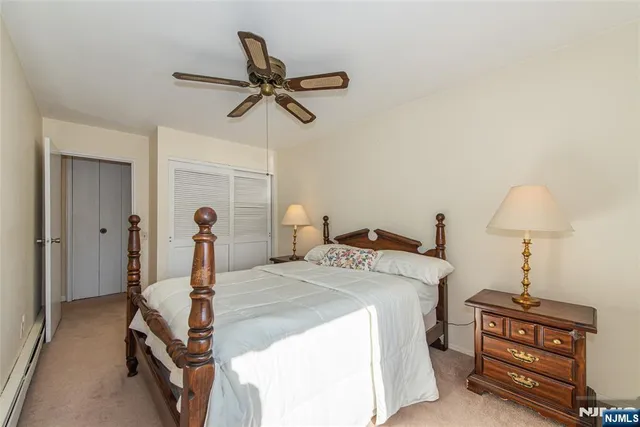 a bed room with a bed and a chandelier