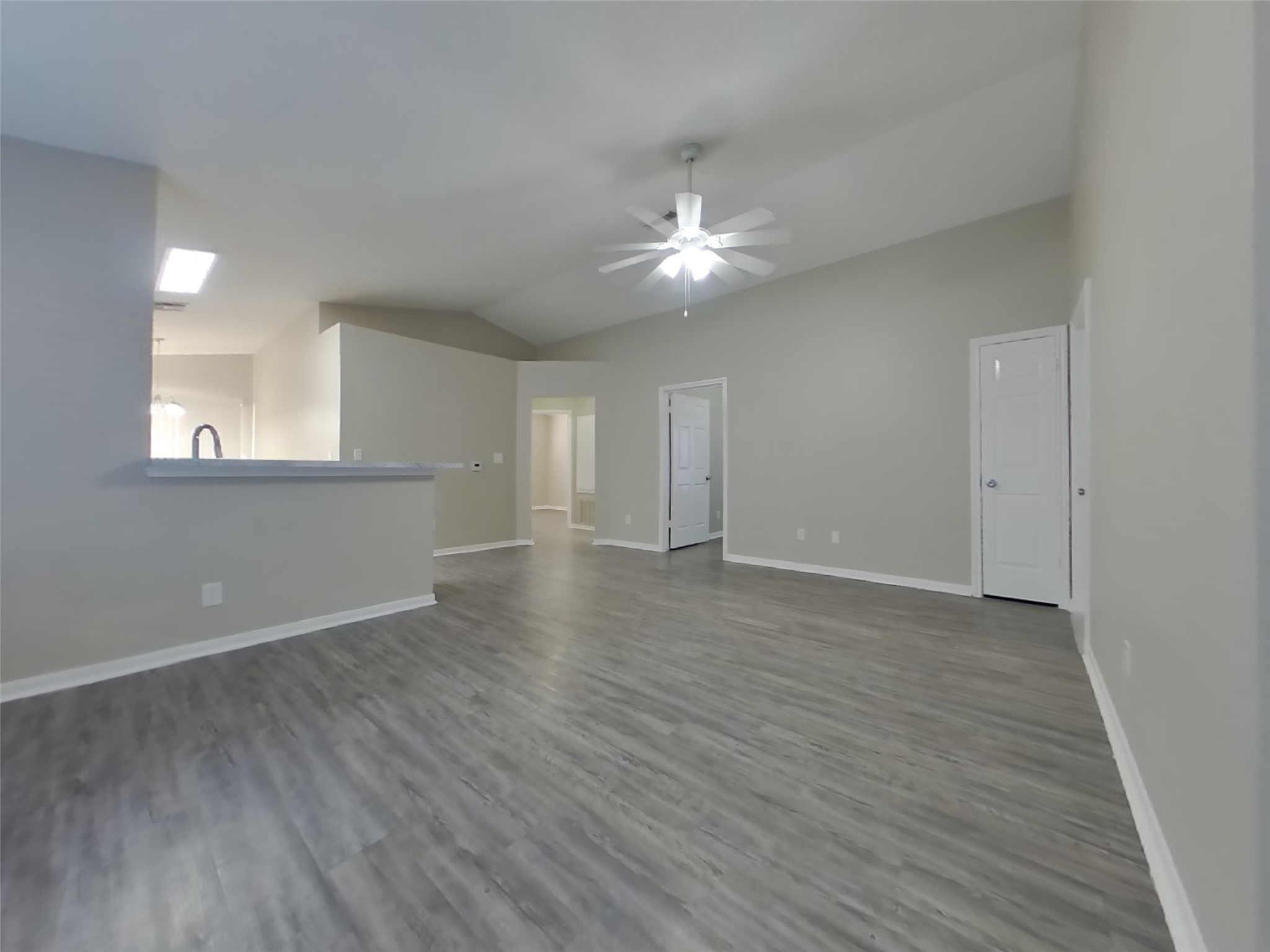 3151 Kelling Street Houston, TX 77045 - Photo 2 of 16 an empty room with wooden floor and windows