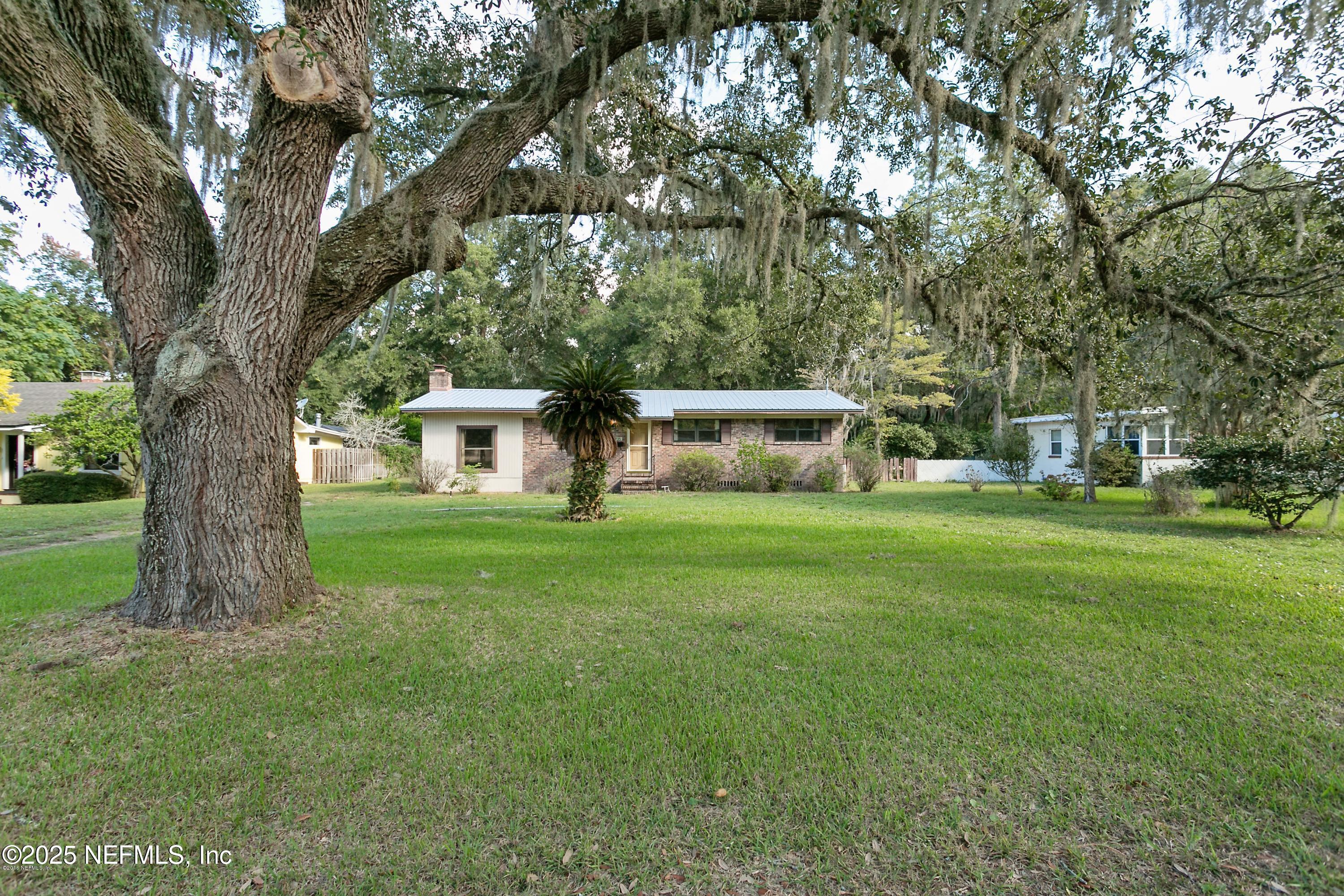 9735 Doolittle Road Jacksonville, FL 32246 - Photo 1 of 3 a view of house with a yard