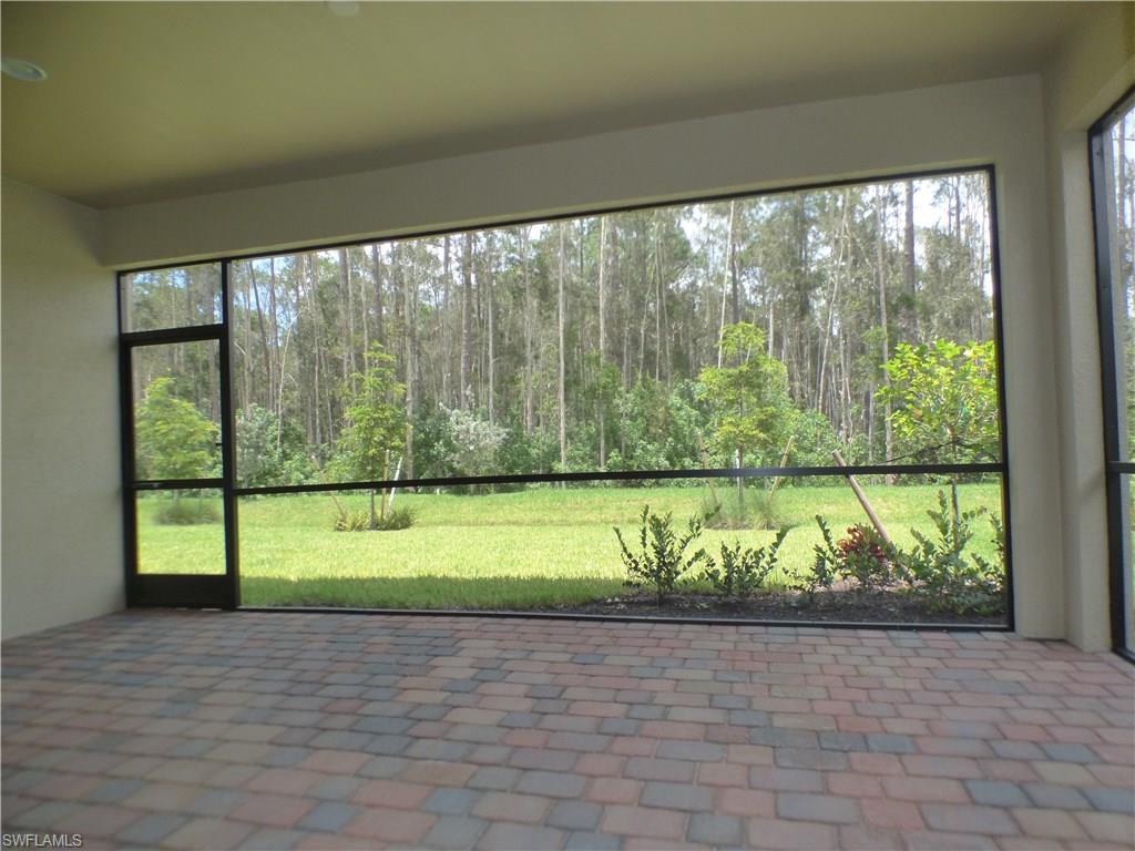 16325 Aberdeen Way Naples, FL 34110 - Photo 13 of 24 a view of a room with wooden floor and a bench