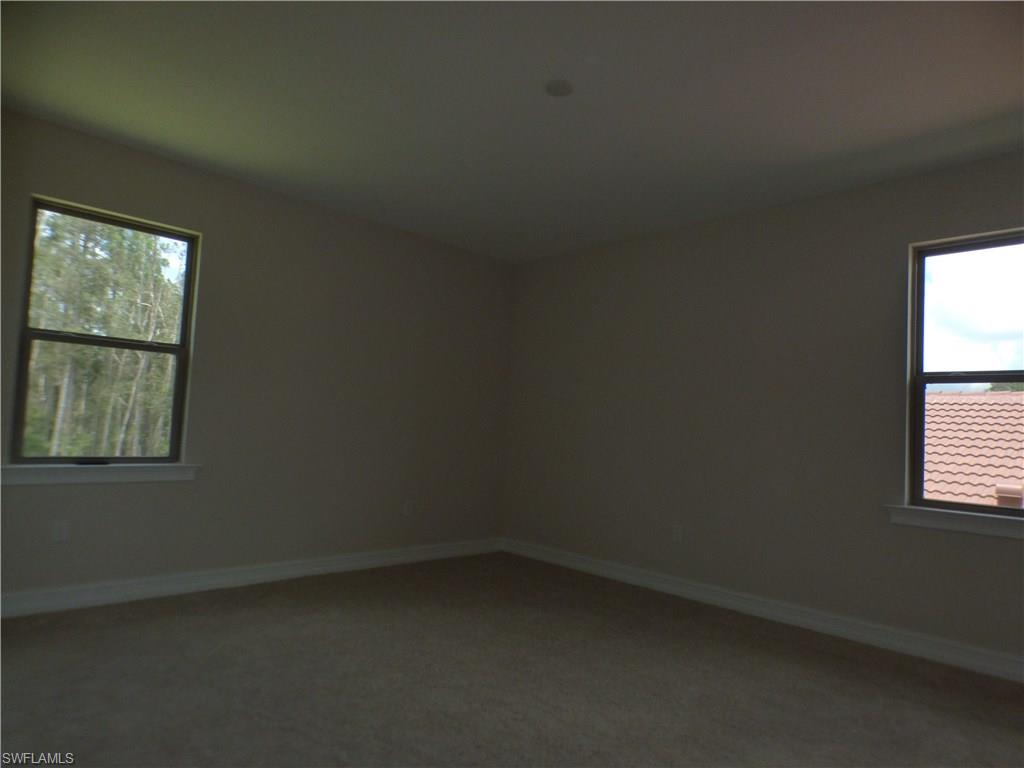 16325 Aberdeen Way Naples, FL 34110 - Photo 14 of 24 an empty room with a window