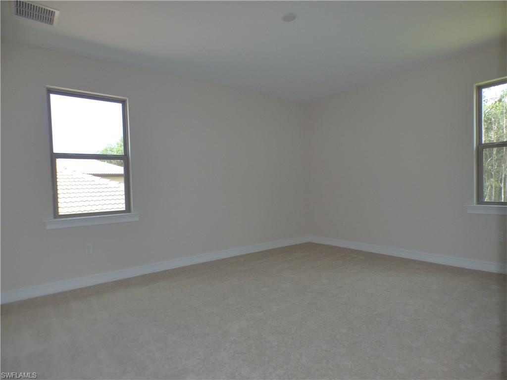16325 Aberdeen Way Naples, FL 34110 - Photo 16 of 24 an empty room with a window