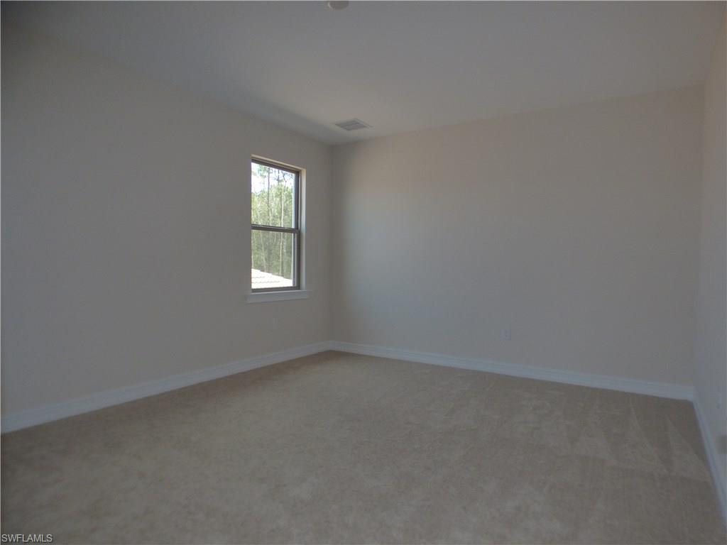 16325 Aberdeen Way Naples, FL 34110 - Photo 17 of 24 an empty room with a window
