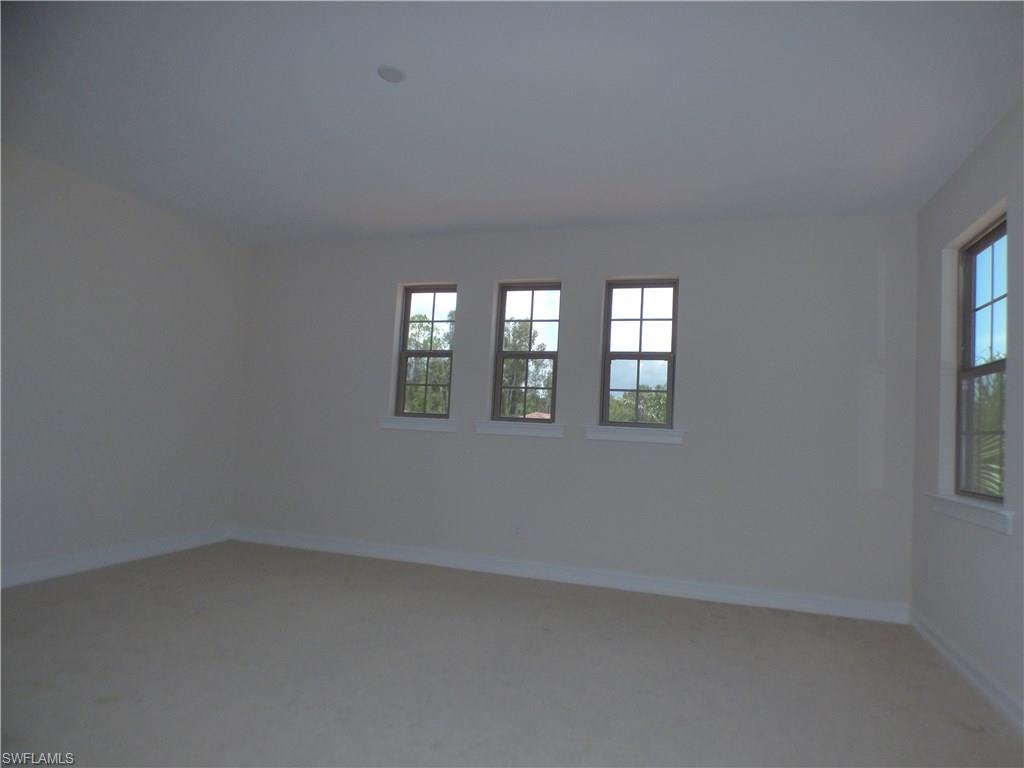 16325 Aberdeen Way Naples, FL 34110 - Photo 5 of 24 an empty room with windows