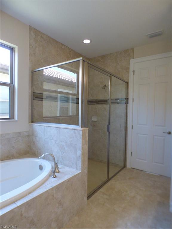 16325 Aberdeen Way Naples, FL 34110 - Photo 7 of 24 a bathroom with a bathtub and a shower