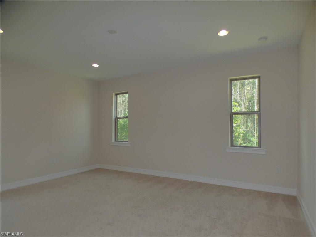 16325 Aberdeen Way Naples, FL 34110 - Photo 8 of 24 an empty room with a window