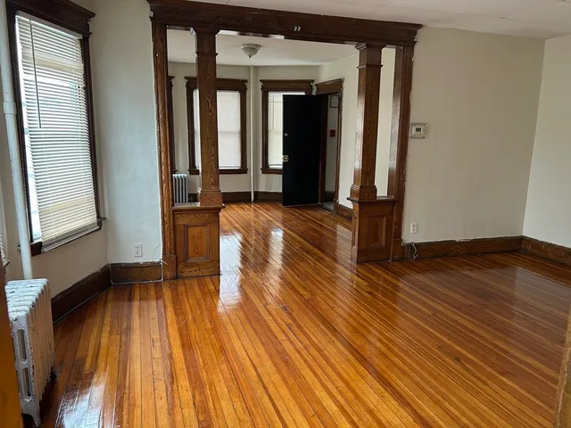 a view of outdoor space with wooden floor and windows