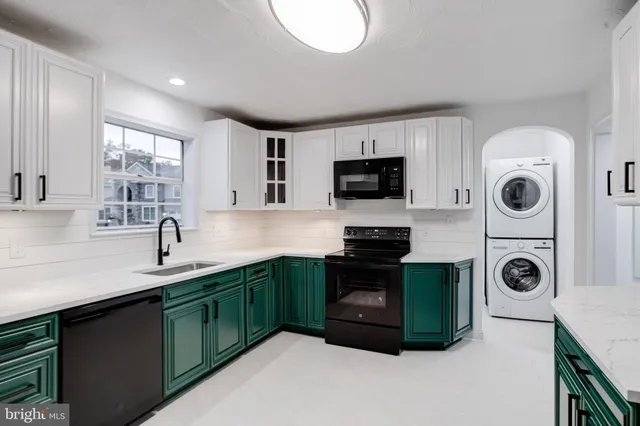 a kitchen with a refrigerator and cabinets