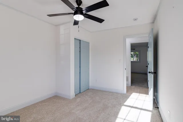 a view of a house with a wooden deck