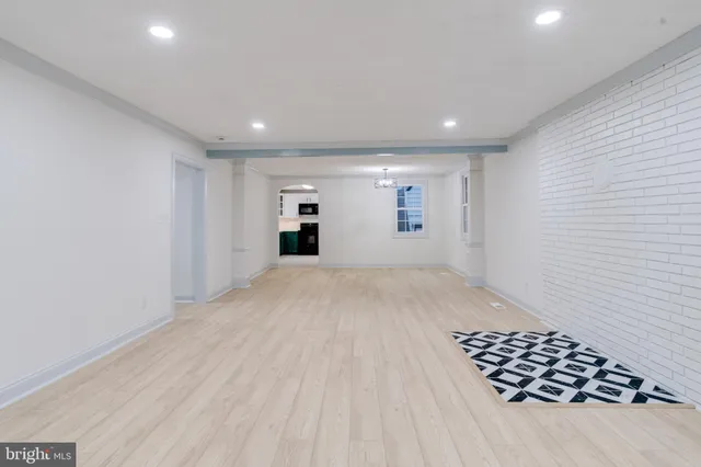 a kitchen with stainless steel appliances granite countertop a refrigerator and a stove