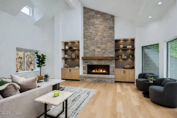 a living room with furniture and a fireplace