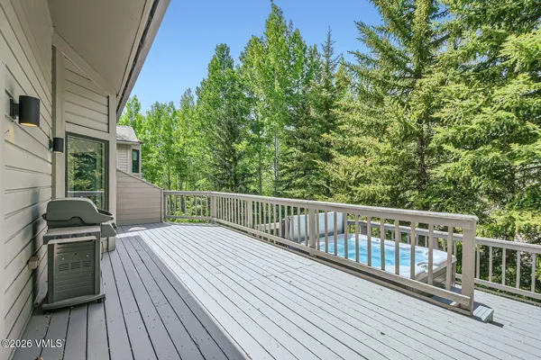 a view of a balcony with wooden floor