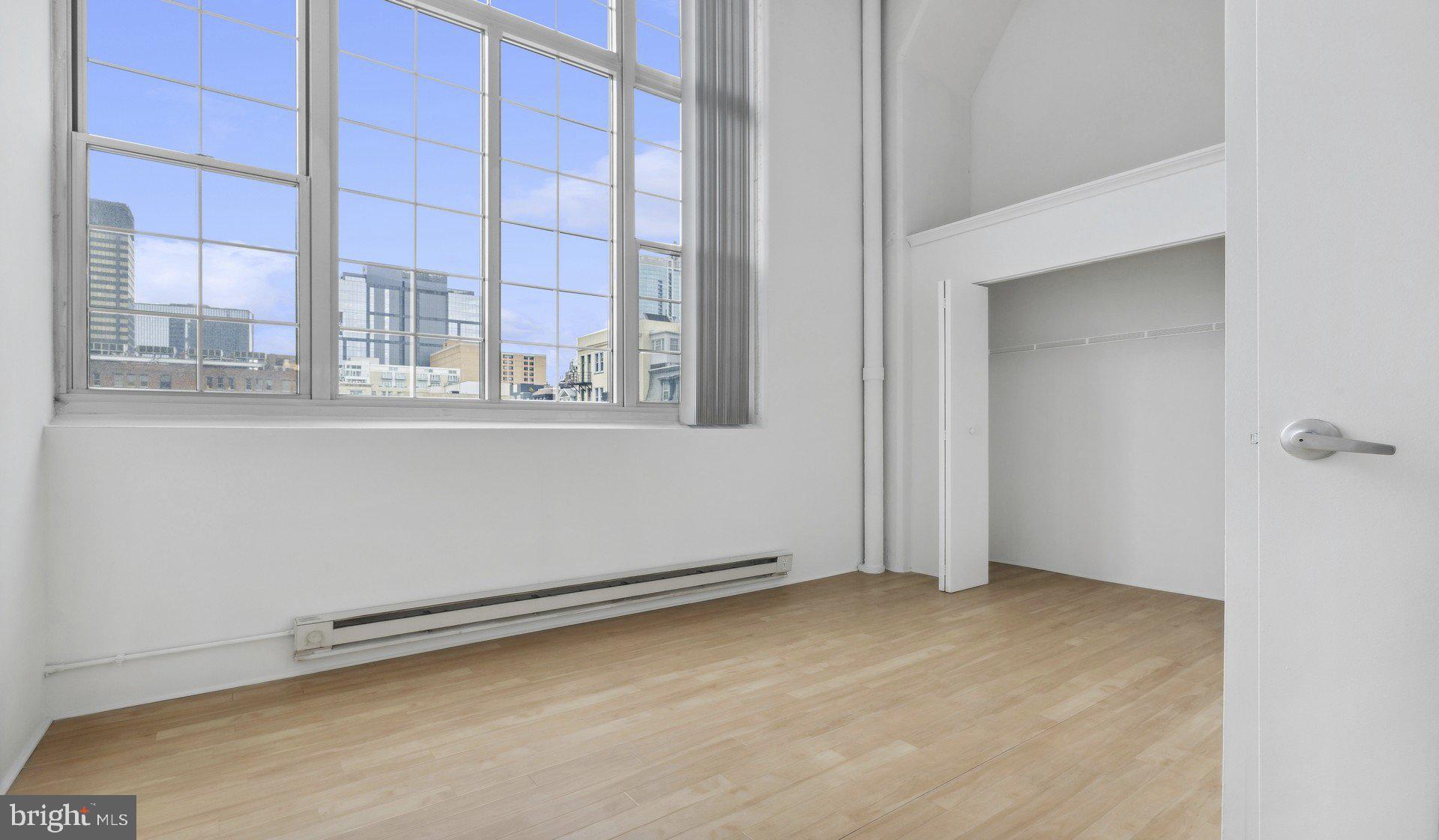 2300 Walnut Street, Unit 0B521 Philadelphia, PA 19103 - Photo 15 of 28 an empty room with a empty space and windows