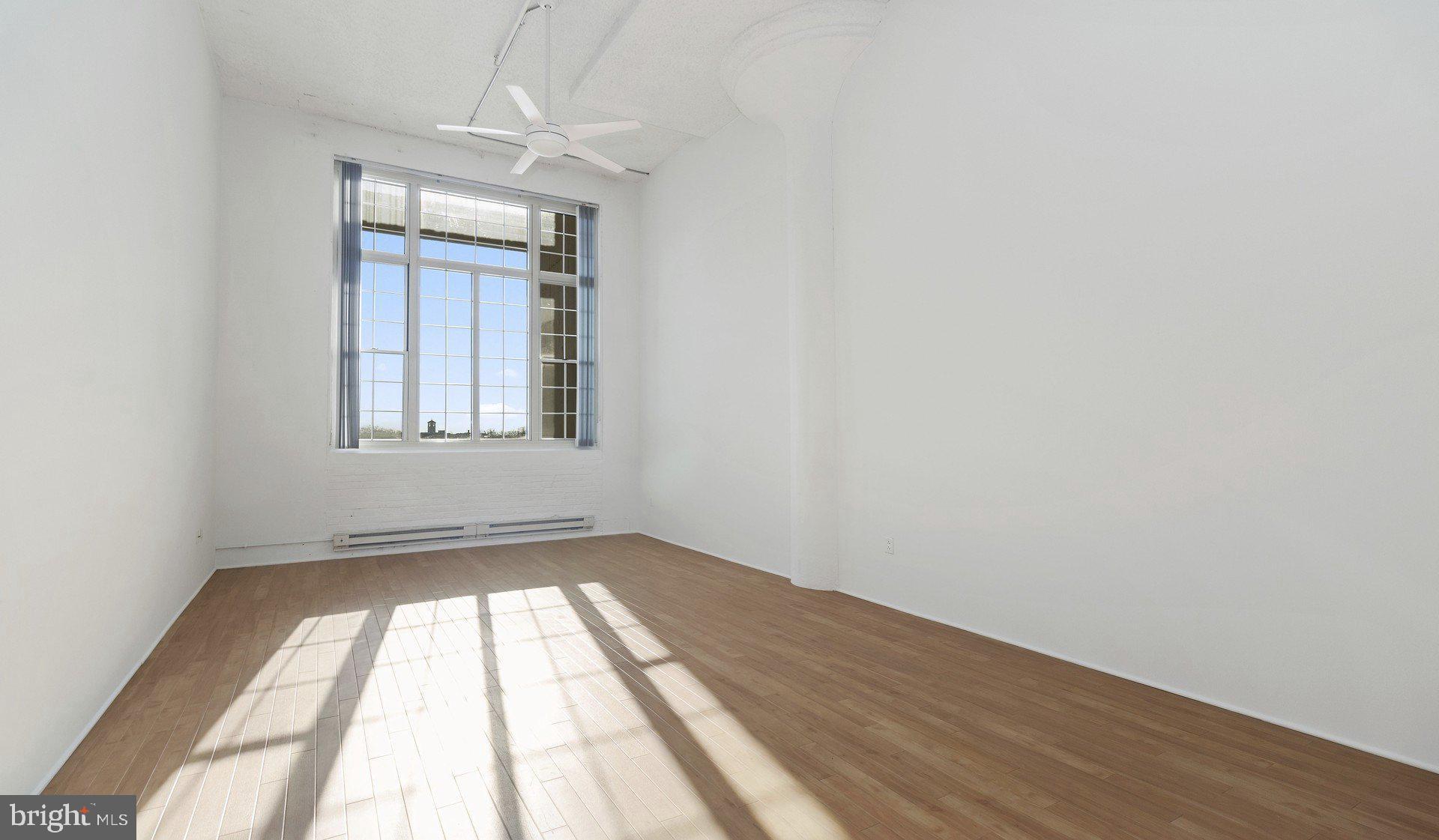 2300 Walnut Street, Unit 0B521 Philadelphia, PA 19103 - Photo 8 of 28 wooden floor in an empty room with a window